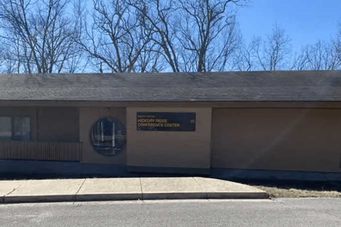 an empty parking lot in front of a building