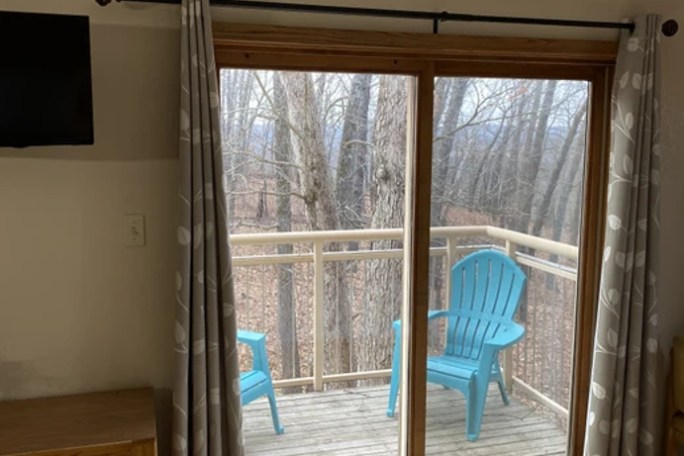 a bedroom with a large window