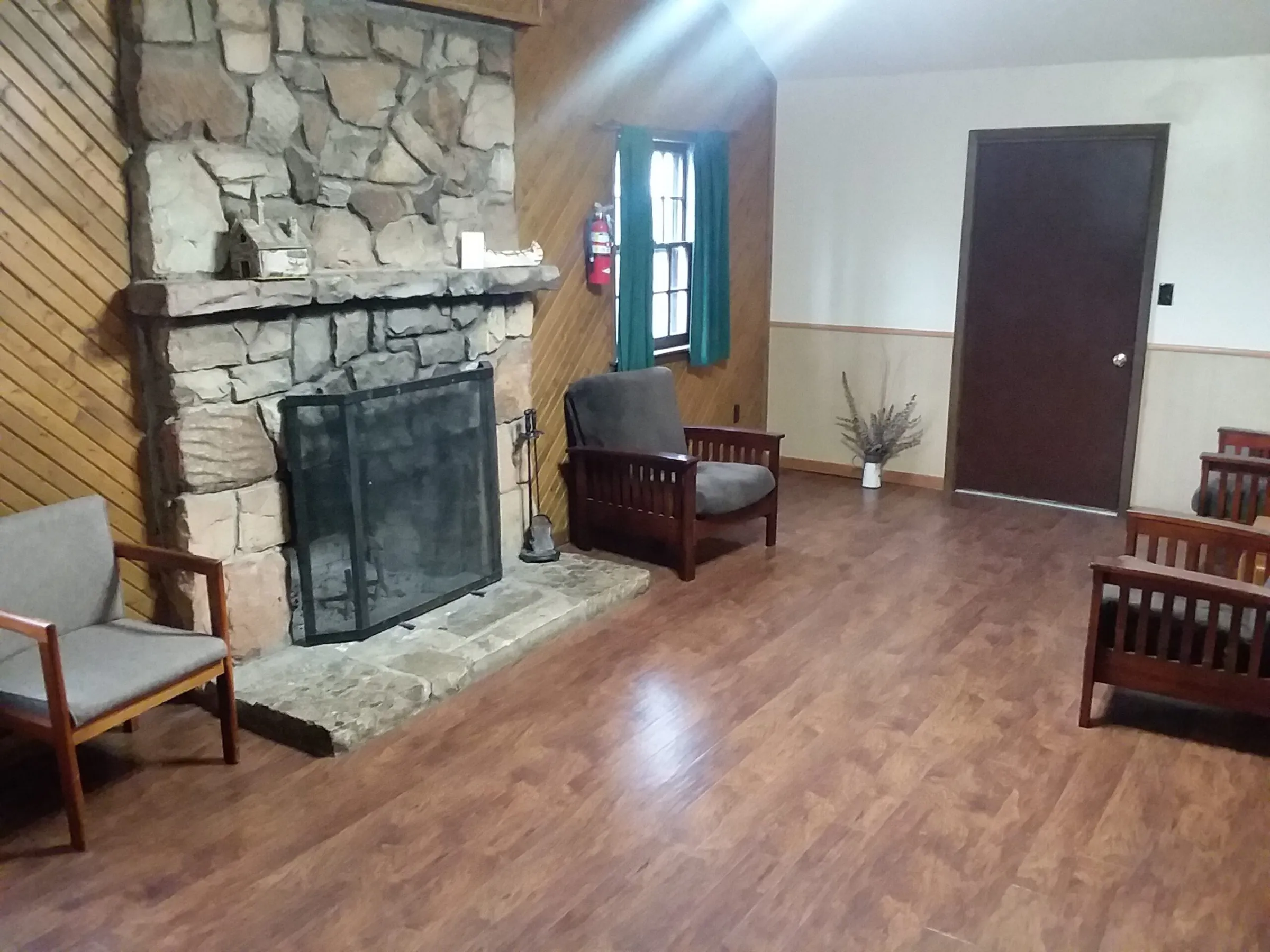 a living room filled with furniture and a fireplace
