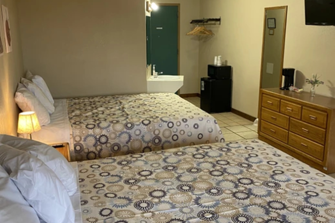 a bedroom with a large bed in a room