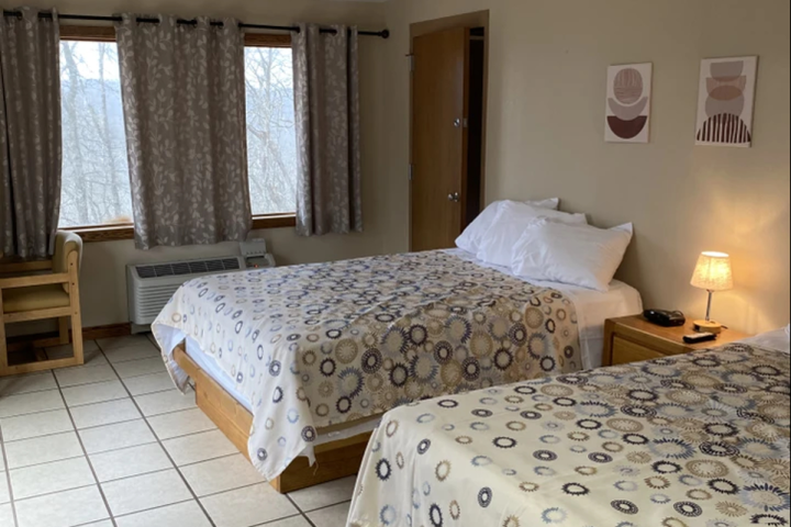 a bedroom with a large bed in a room