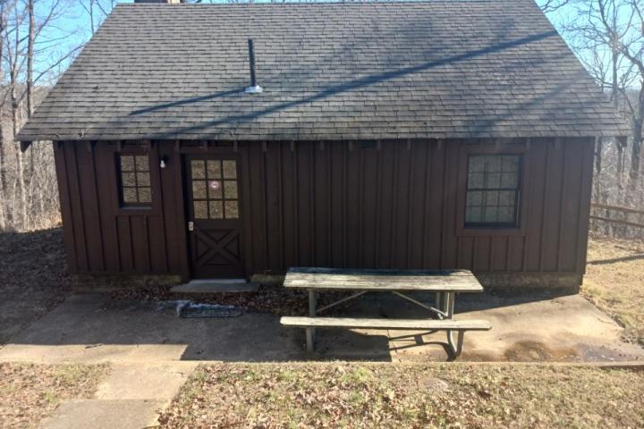 a wooden bench in front of a house