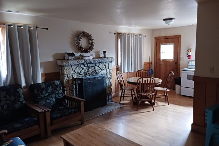 a living room filled with furniture and a wood floor
