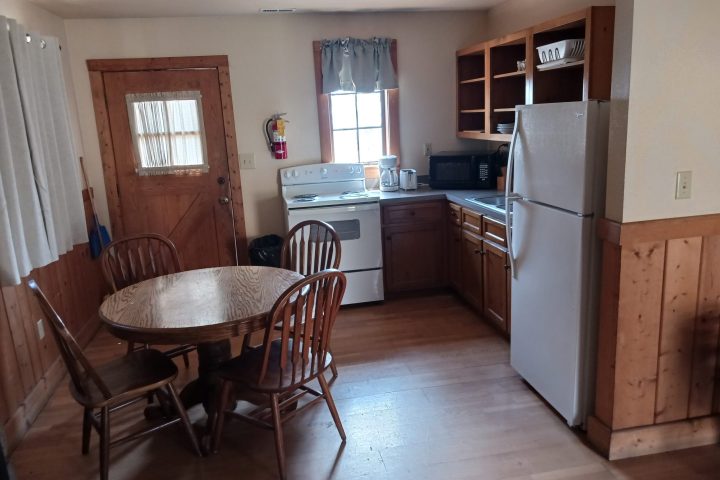 a kitchen with a dining room table
