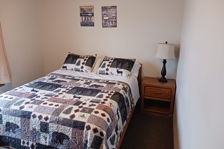 a bedroom with a bed in a room