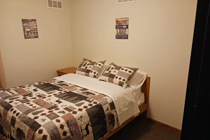 a bedroom with a large bed sitting in a room