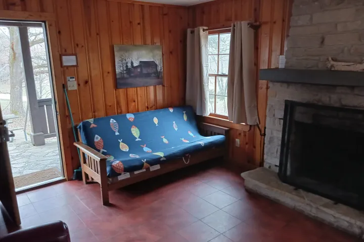 a living room filled with furniture and a large window